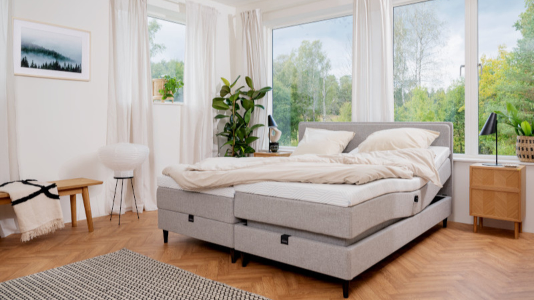A modern, light-toned bedroom with a Tempur bed